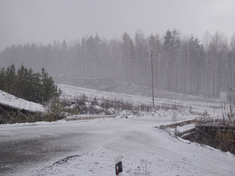 Snowfall above Serov highway